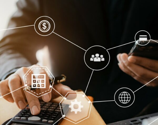 Investors have to calculate investment cost calculator and hold a mobile phone in hand.